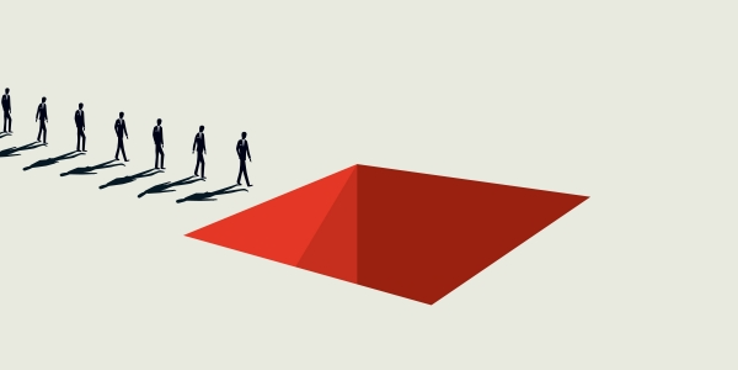 Line of people walking toward a red, square hole